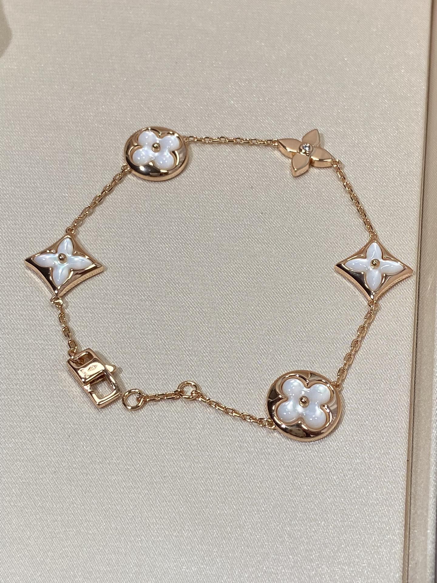 [Panda Jewelry]STAR AND SUN 5 MOTIF MOP PINK GOLD BRACELET